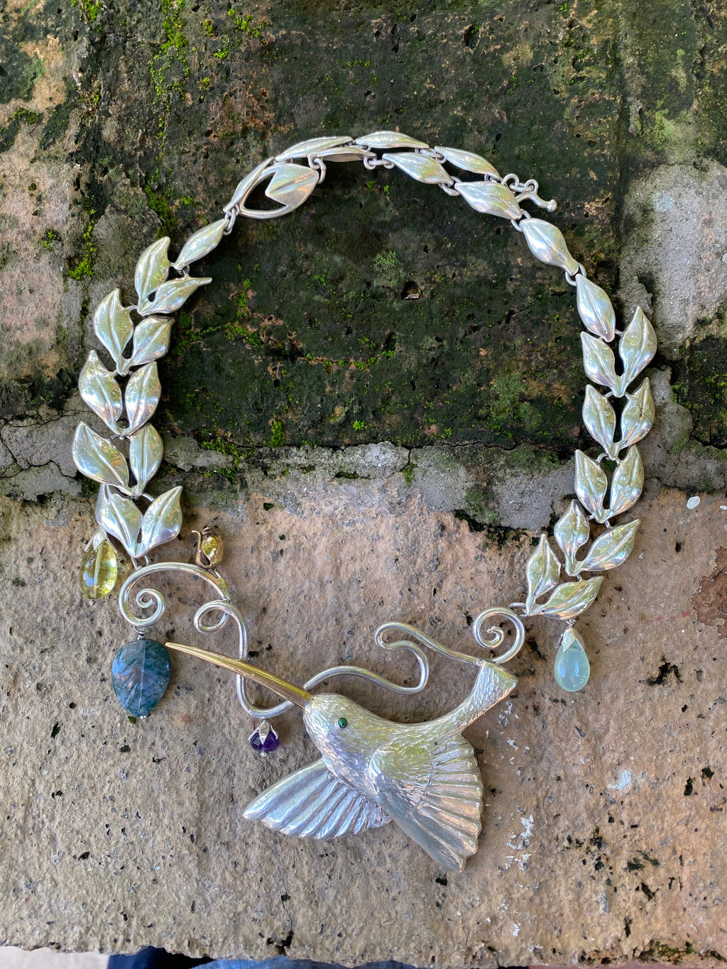 HAND REPOUSEE, FINE SILVER HUMMING BIRD NECKLACE WITH PRECIOUS STONES.