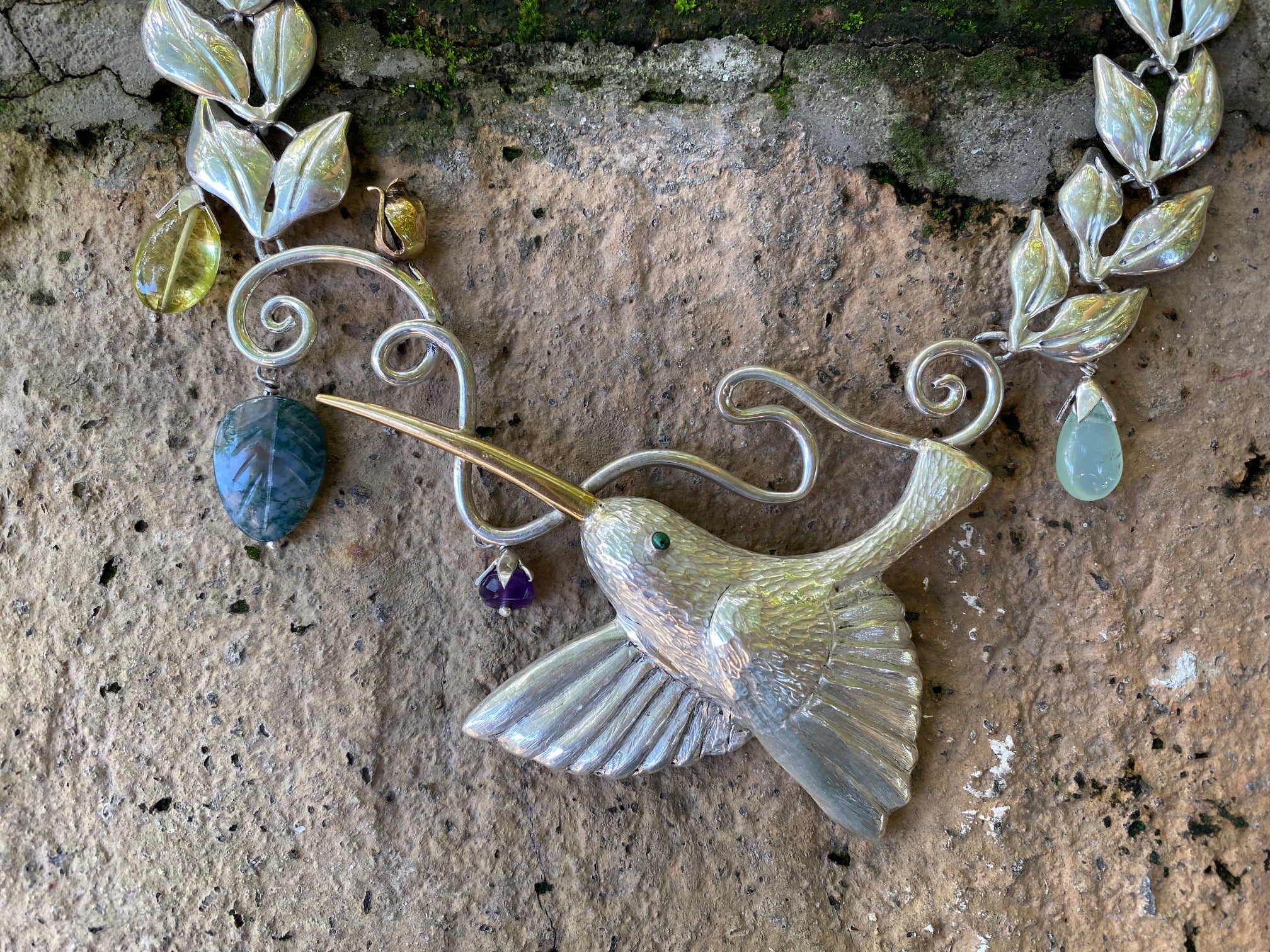 HAND REPOUSEE, FINE SILVER HUMMING BIRD NECKLACE WITH PRECIOUS STONES.
