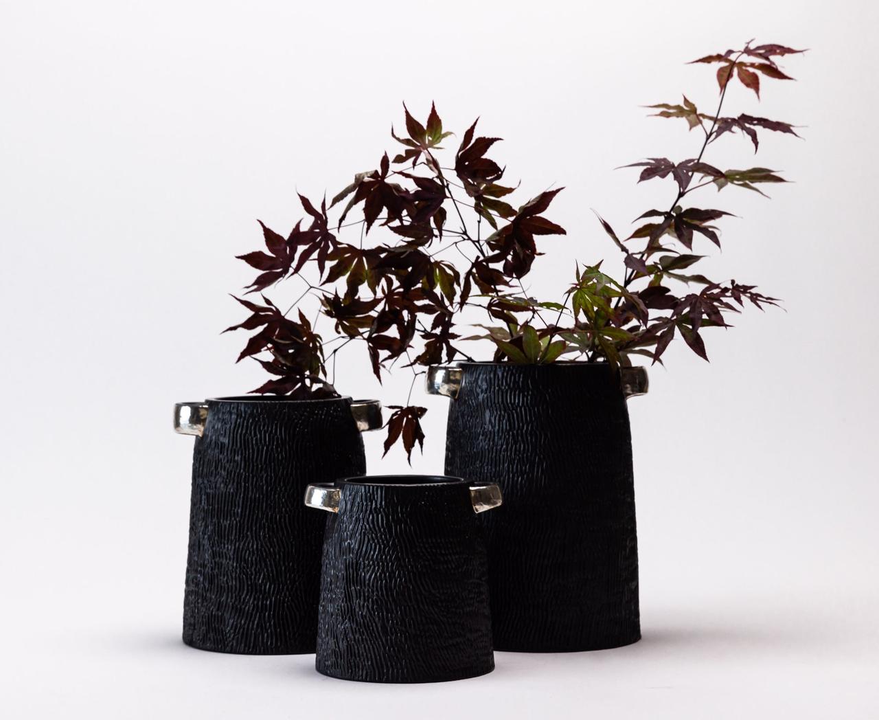 PORCELAIN CANISTERS WITH PURE SILVER FUSION.