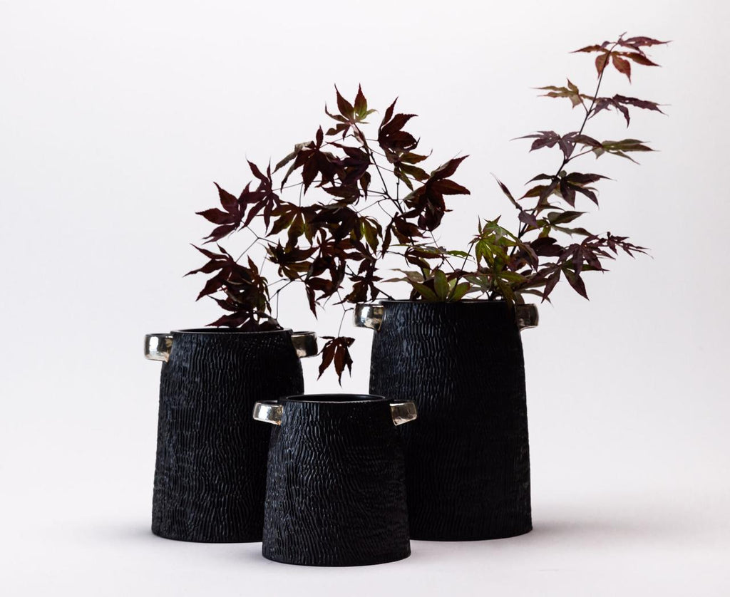 PORCELAIN CANISTERS WITH PURE SILVER FUSION.