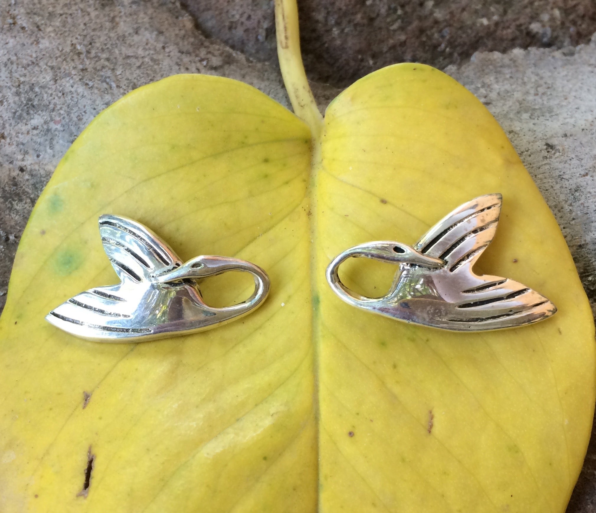 SWAN EARRINGS.
